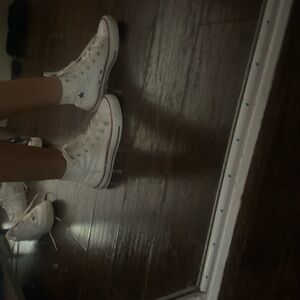 white non platformed chuck taylor converse.